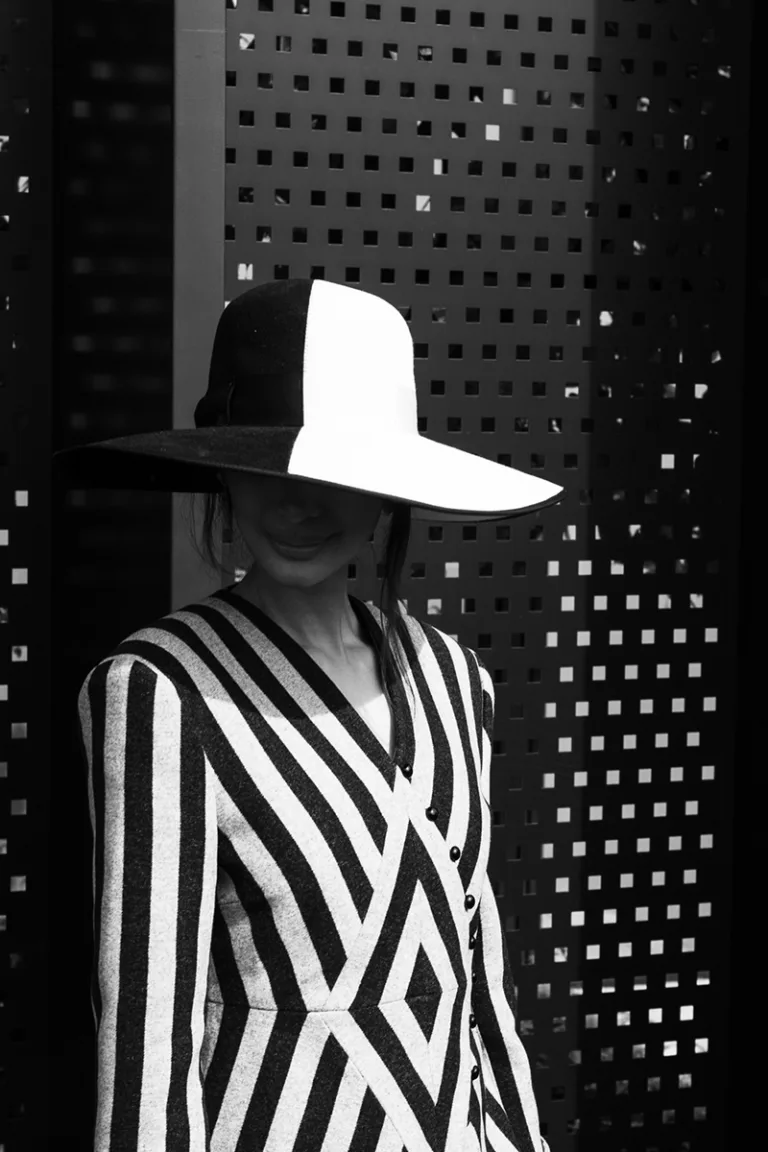 Portrait of woman with big hat. black and white